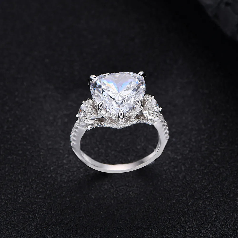 Heart-shaped diamond ring on white background, 925 silver band, open inlay setting