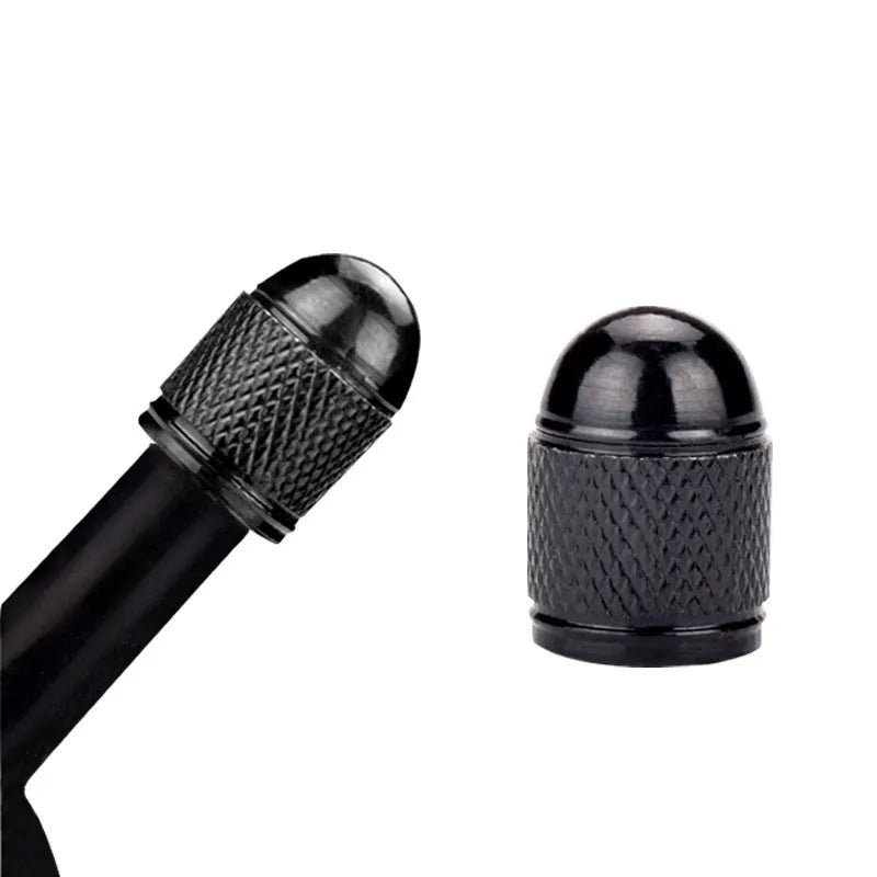 Aluminium mountain bike tyre valve dust cap in gold, red, silver, blue, and black colours.