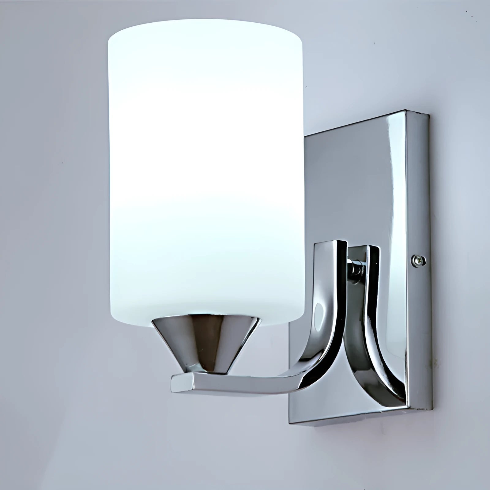 Modern chrome and glass wall lamp with single head design showing glass lampshade and metallic finish