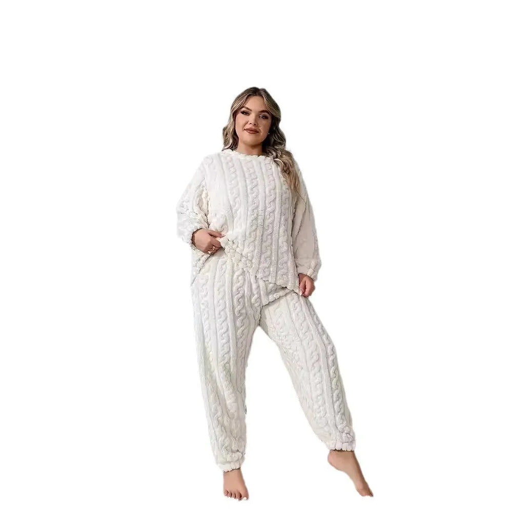 Creamy white women's long sleeve crew neck top and trouser set on a hanger.