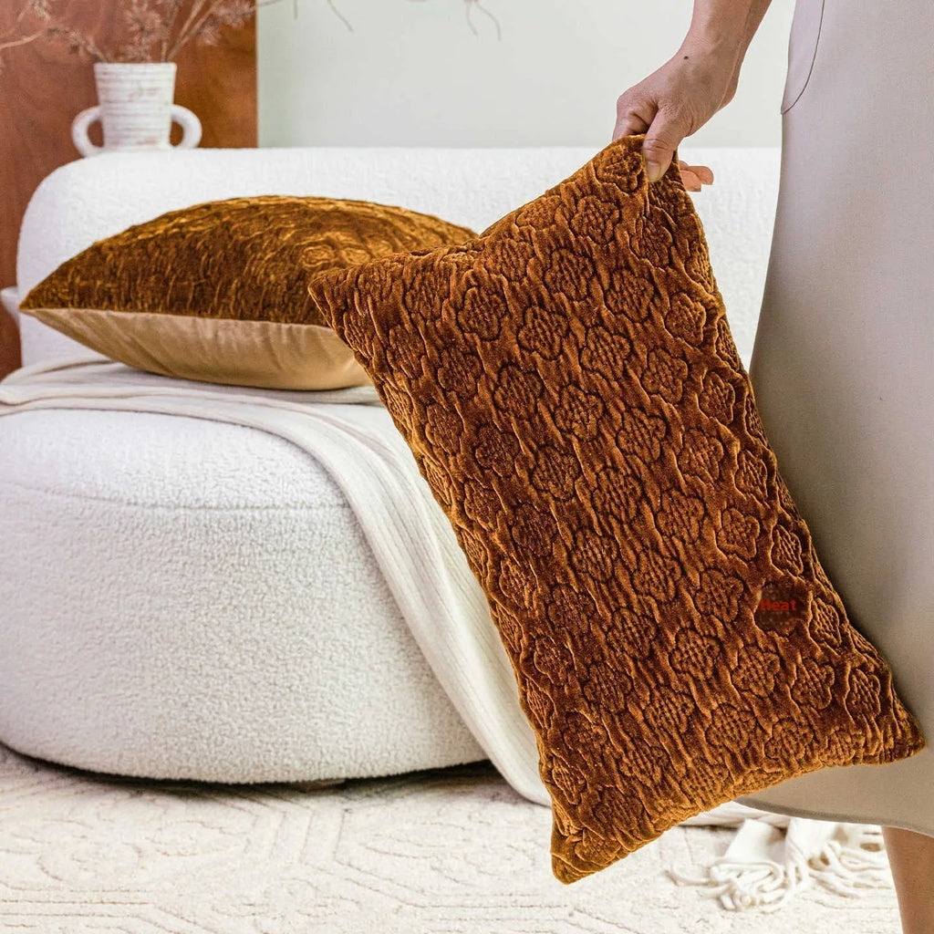 Brown gold antique Chinese style quilted cushion pillow on a sofa