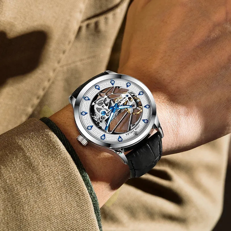 Men's silver case mechanical watch with white dial, blue hands, black leather strap, and stainless steel buckle