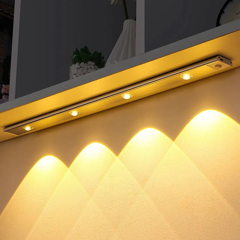 Thin silver aluminium USB rechargeable LED light strip with motion sensor for cabinet mounting