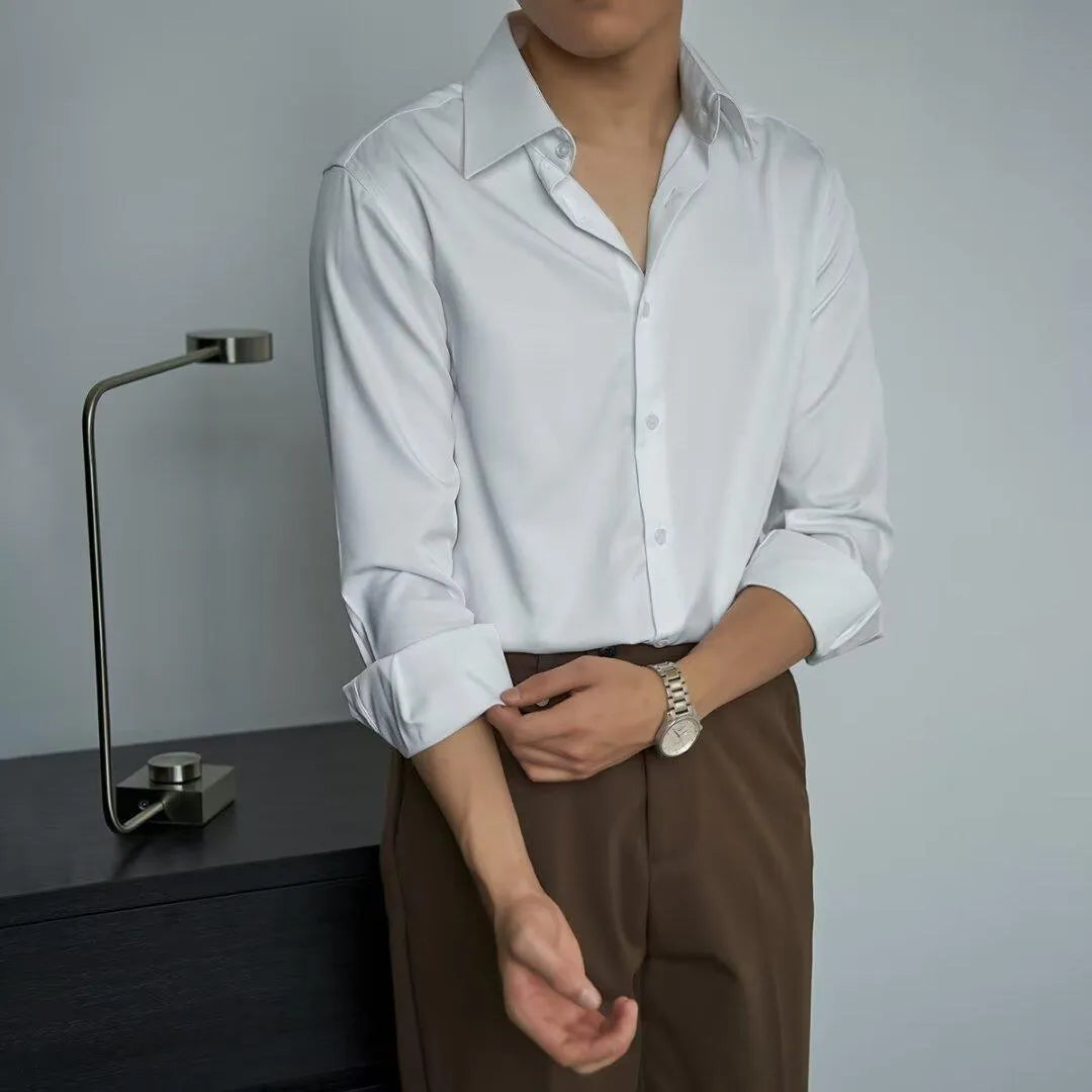 Man wearing a black long sleeve Korean style cardigan shirt with a loose fit and Japanese retro design details.