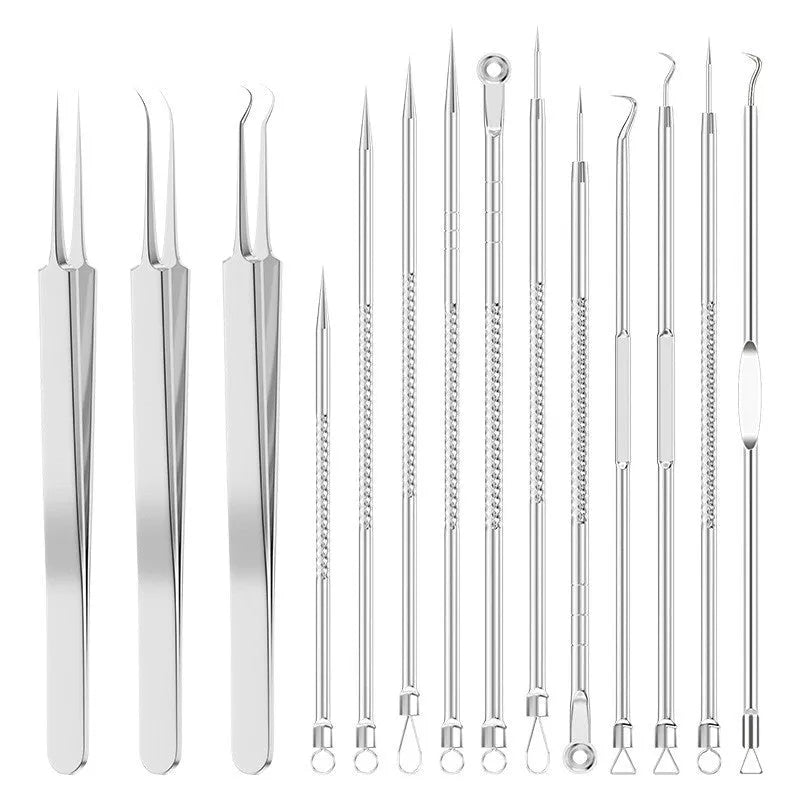 Four silver metal acne needles with fine pointed tips laid out on a flat surface.