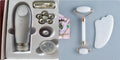 White jade double-headed facial roller and gua sha scraping board set on a plain background.