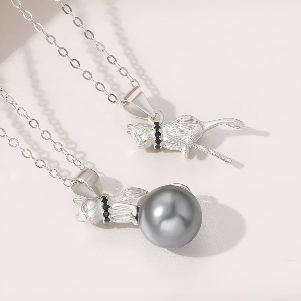 Sterling silver cat pendant necklace on a chain, showcasing the feline design in an elegant style.