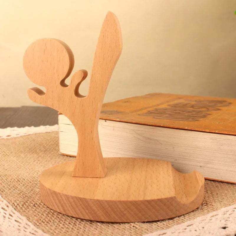 Decorative resin mobile phone stand in a choice of styles including animal figures and wood-effect designs.