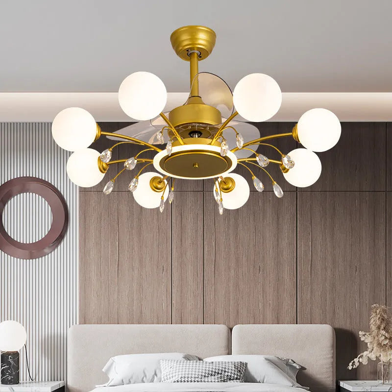 Gold and black ceiling fan lamp with acrylic shade and metal blades, showing remote control
