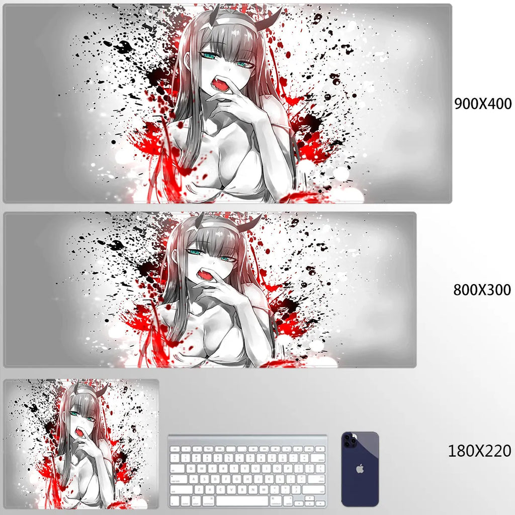 Pink cloth keyboard mat with Darling in the Franxx anime print on a desk