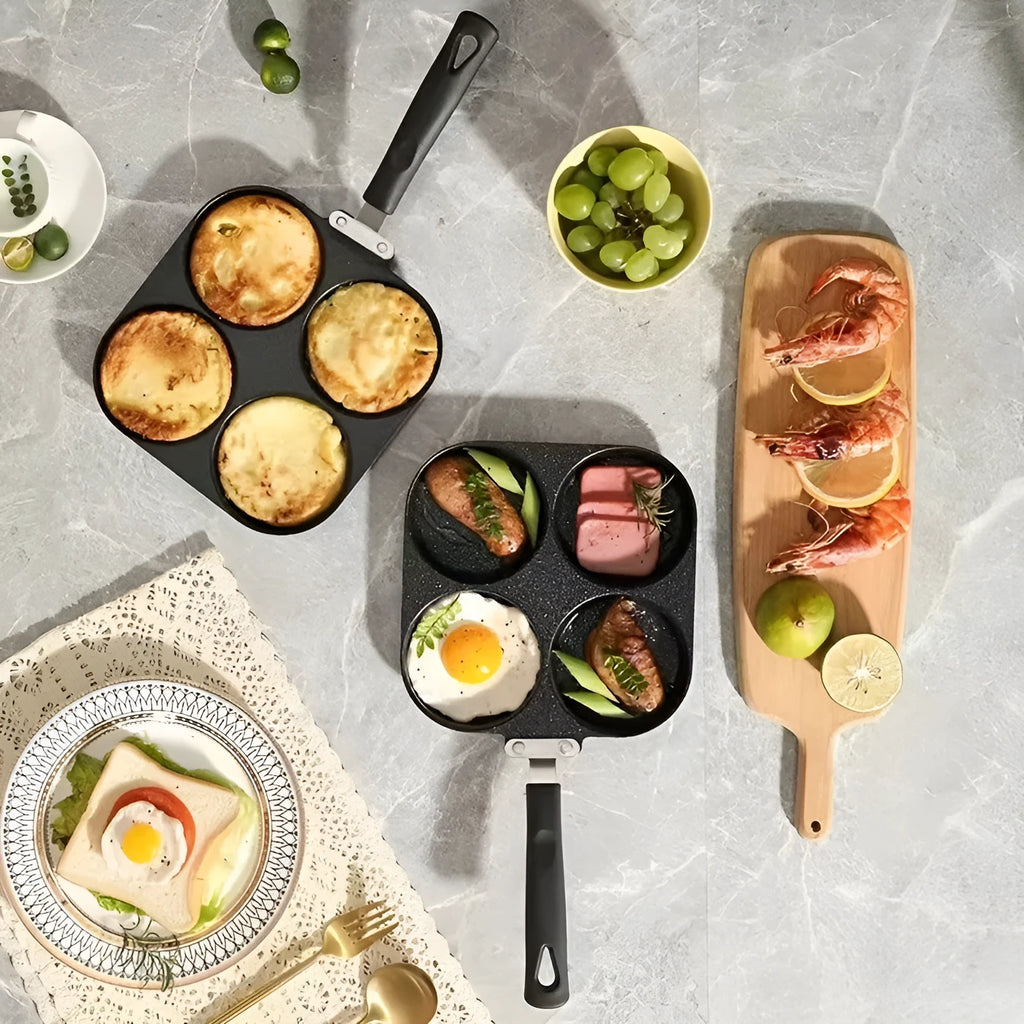 Non-stick four-hole frying pan with medical stone coating on a gas hob cooking eggs and pancakes