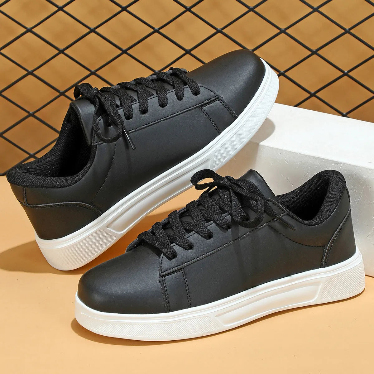 Casual beige brown platform sneakers with a cross strap and round toe on a flat rubber sole.