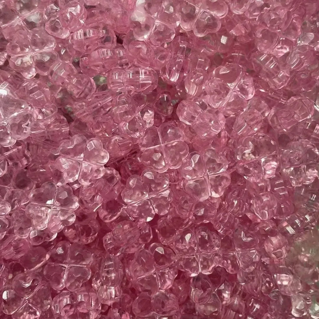 High transparency acrylic fat clover camellia beads scattered on white surface
