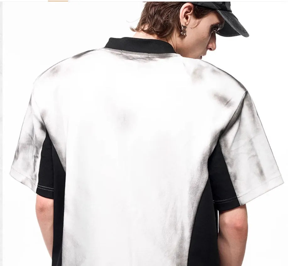 Women's short sleeve V-neck top with a black and white letter snake pattern print and padded shoulders.