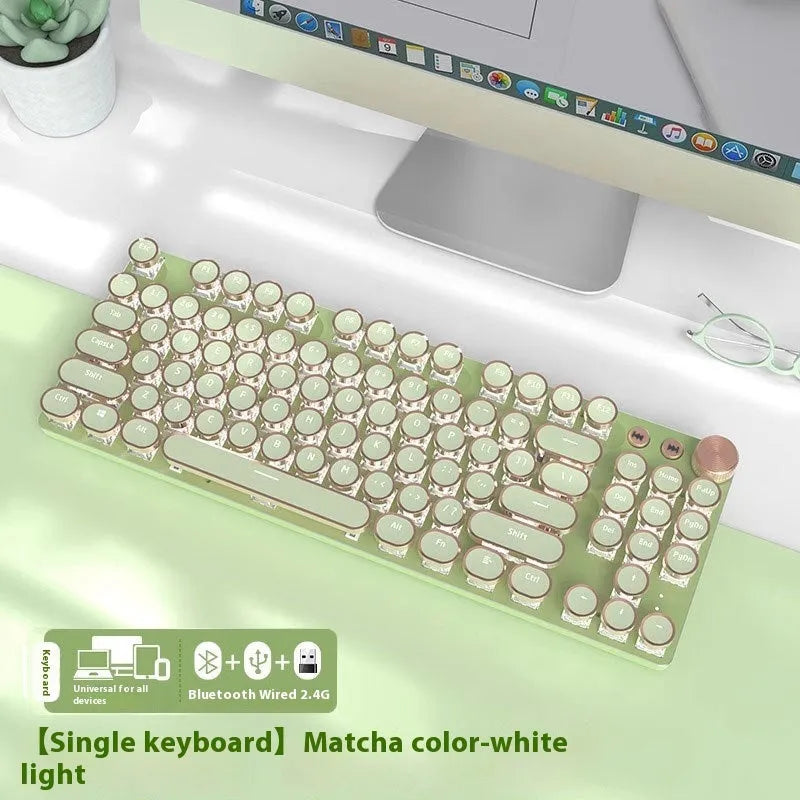 Matcha green mechanical gaming keyboard with multifunction knob on a desk