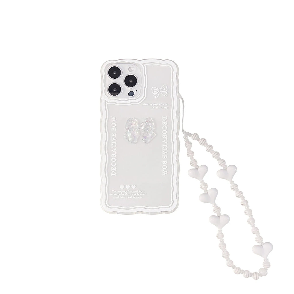 Transparent iPhone case with a raised 3D bow decoration and a white fabric lanyard attached.