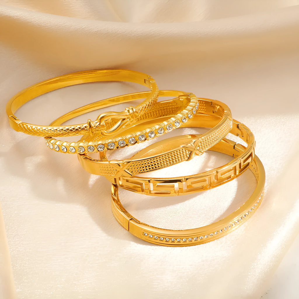 Titanium steel 18K gold electroplated bracelet with round zircon accents in SZ67 Gold colour on a plain background