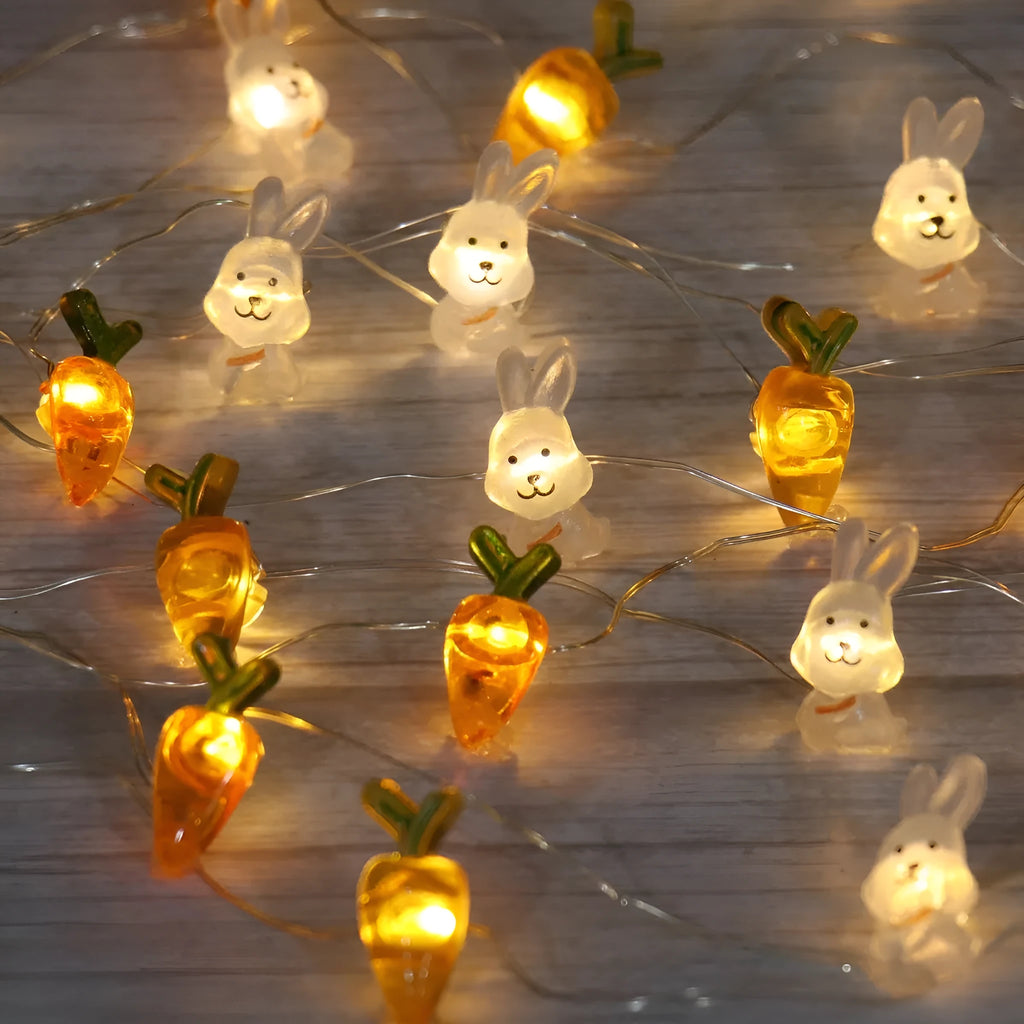 Easter LED bunny string lights with carrot and transparent white rabbit bulbs on a dark background