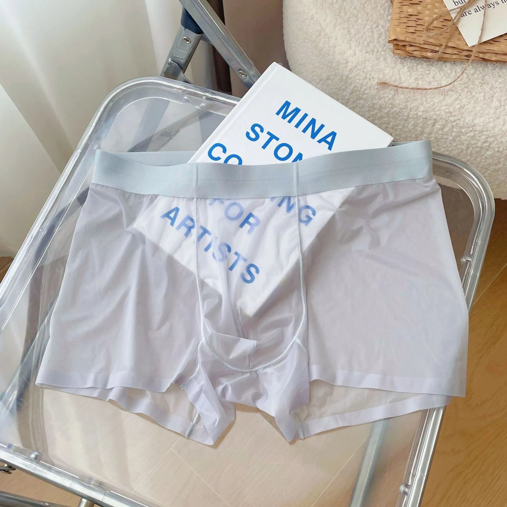 Men's thin seamless boxer shorts in knit nylon fabric, shown in light brown colour with quick-dry and breathable properties.