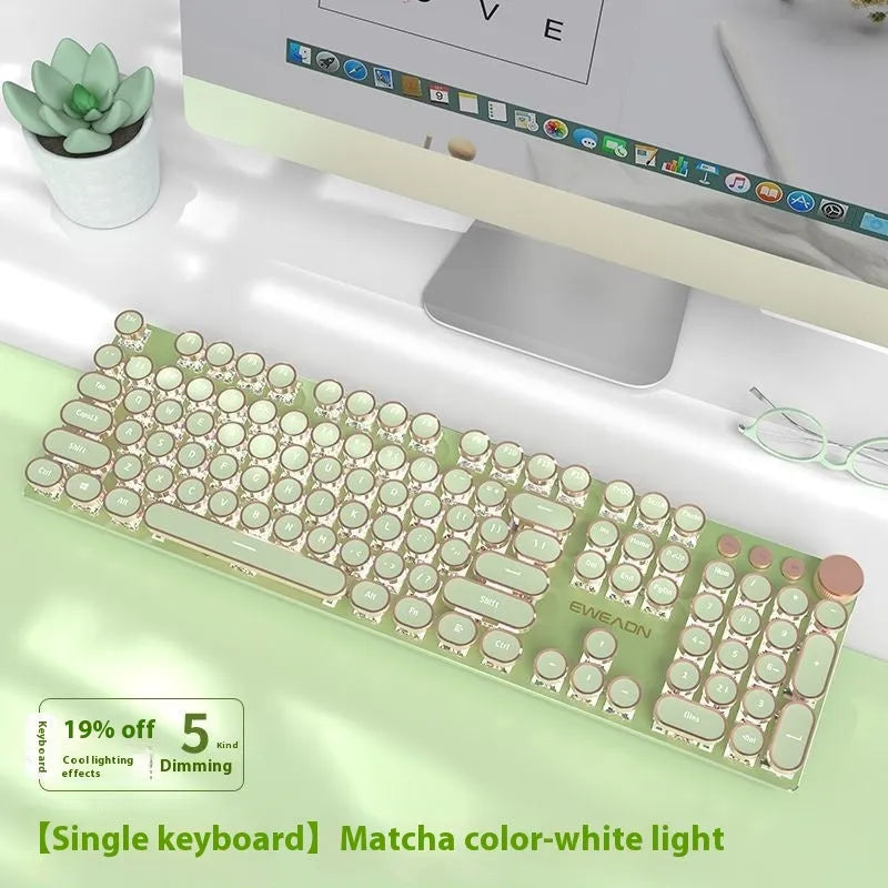 Matcha green mechanical gaming keyboard with multifunction knob on a desk