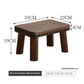Solid wood distressed finish shoe changing stool with bracket structure for the living room.