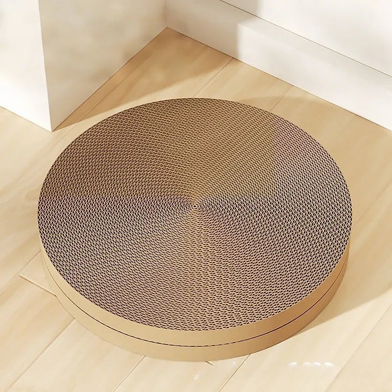 Green and white round cat scratching board with corrugated cardboard surface measuring 55cm across
