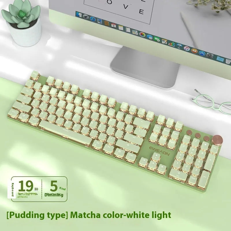 Matcha green mechanical gaming keyboard with multifunction knob on a desk