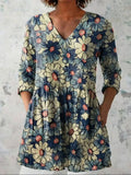 Women's retro-style slim fit long-sleeved top with a digital print pattern, shown on a hanger.