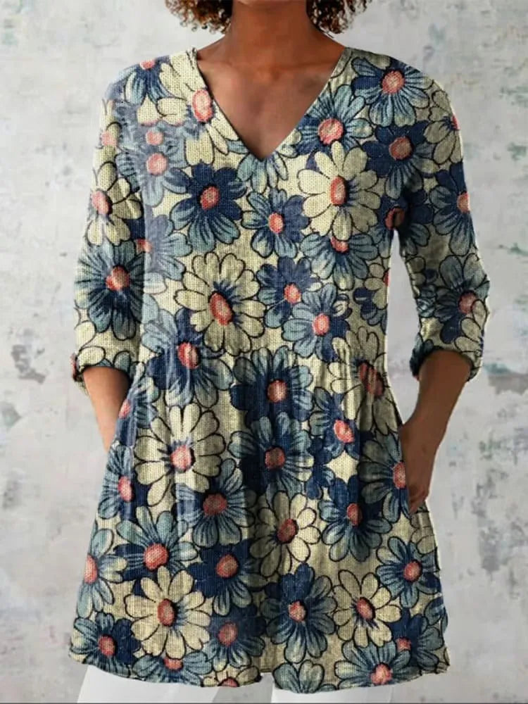 Women's retro-style slim fit long-sleeved top with a digital print pattern, shown on a hanger.