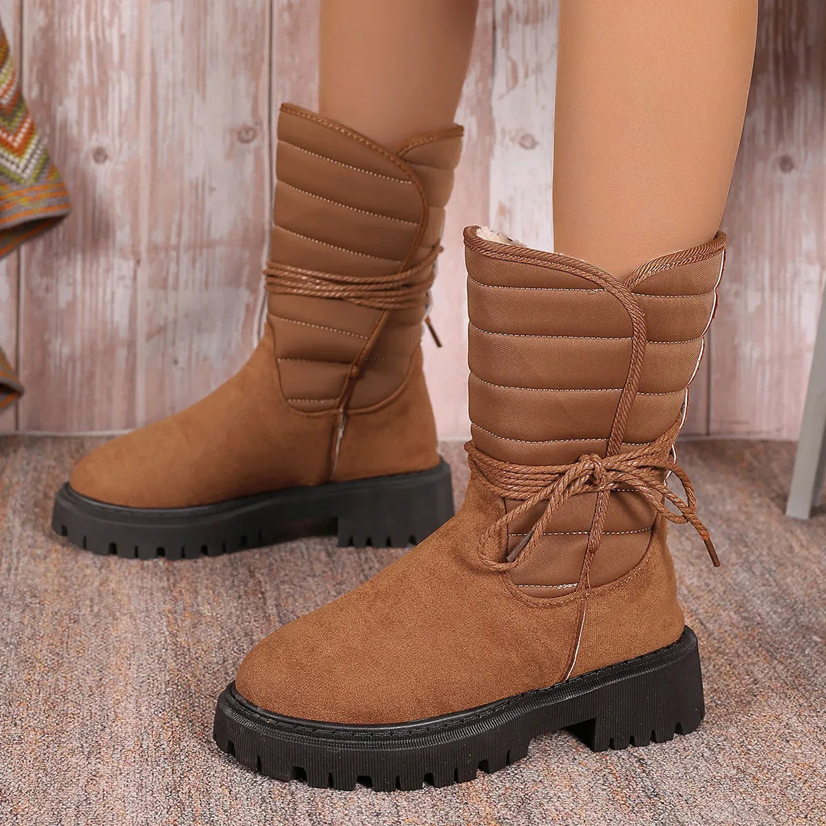 Women's black chunky heel snow boots with lace-up front and fleece lining