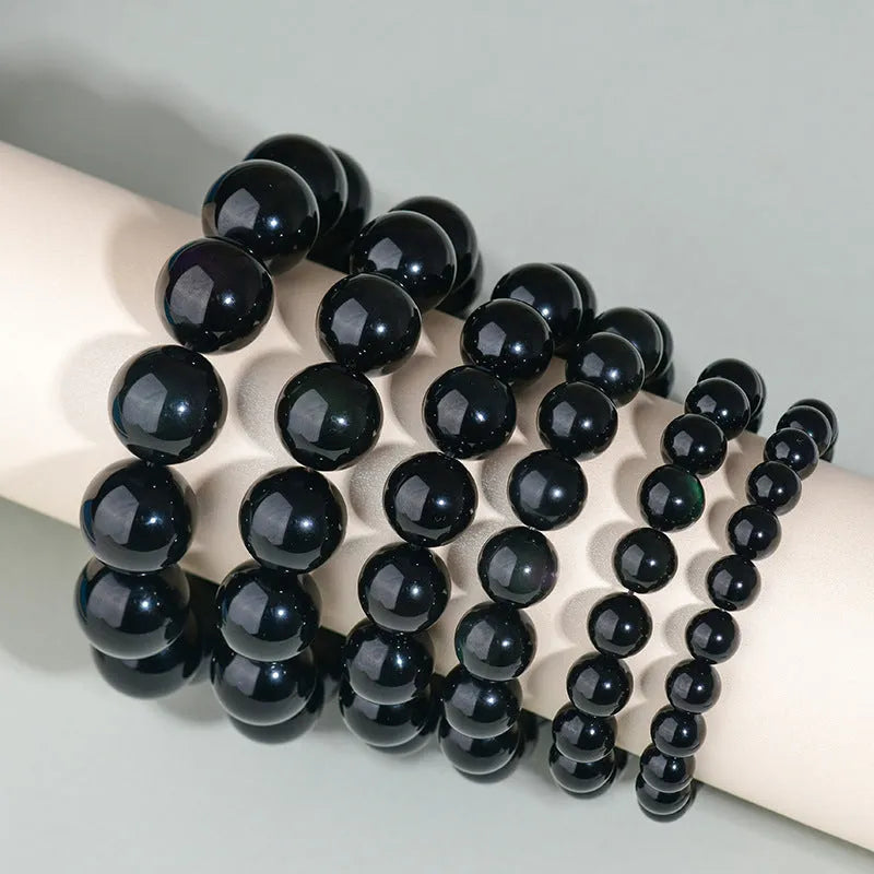 Hand-woven obsidian couple bracelet with year of birth symbols in ethnic style design