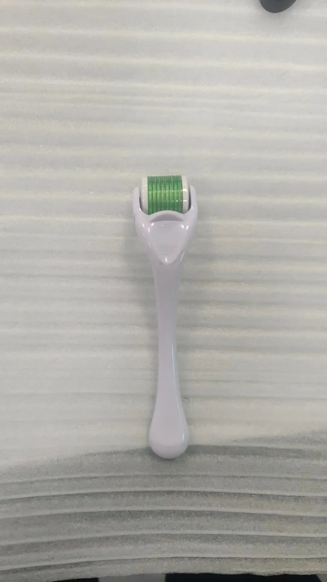 Professional mechanical micro needle derma roller showing colour variations and needle specifications
