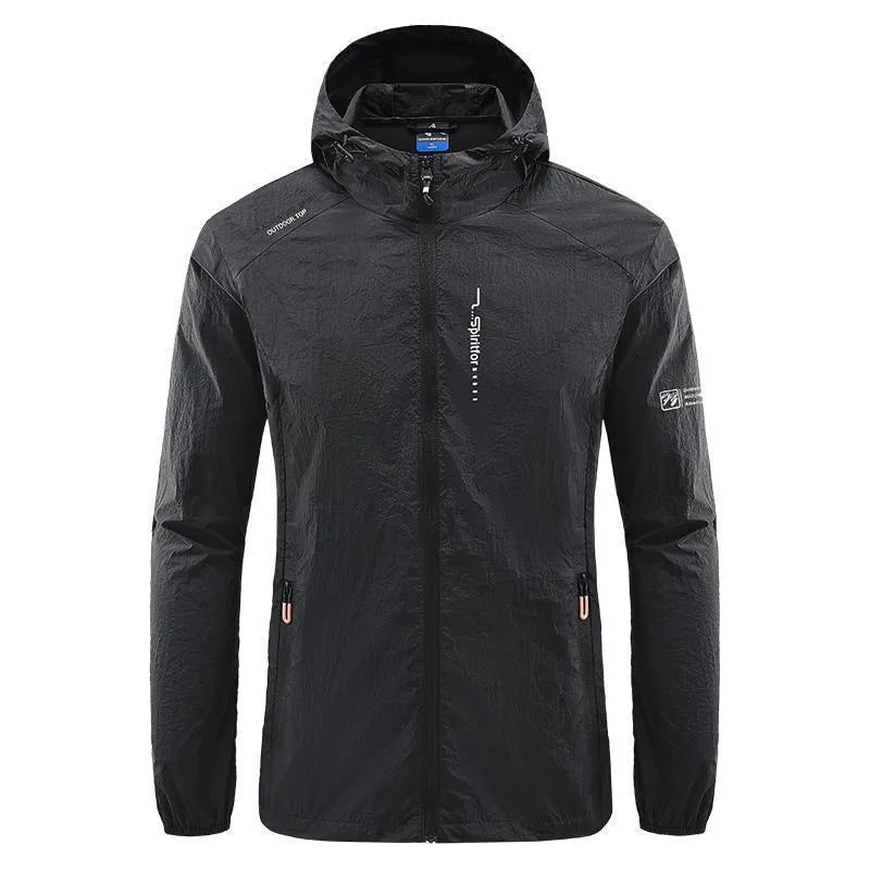 Man wearing a light grey loose-fitting hooded nylon summer jacket for sun protection.