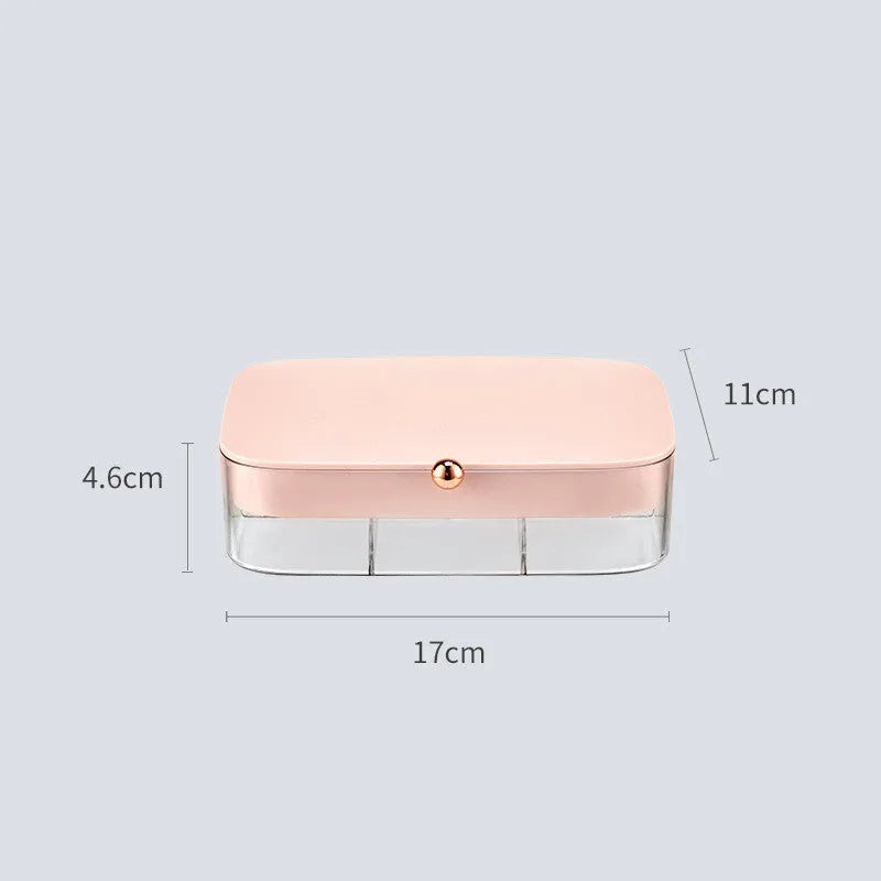 Green minimalist jewellery storage box with multiple internal compartments for rings and earrings.