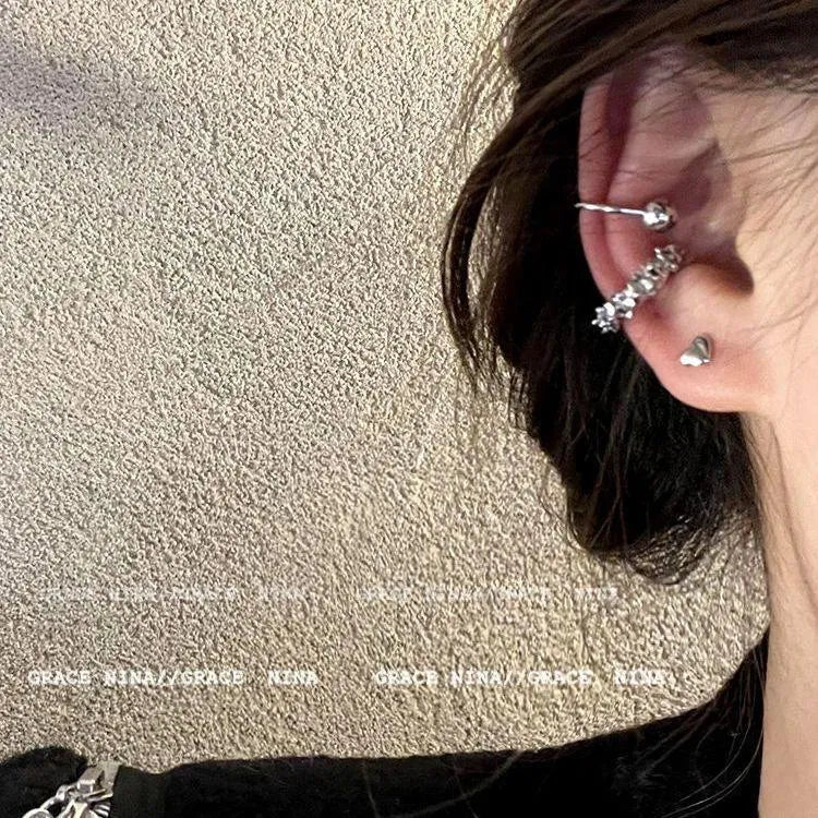 Pair of silver-toned geometric clip-on earrings with a frosty textured finish.