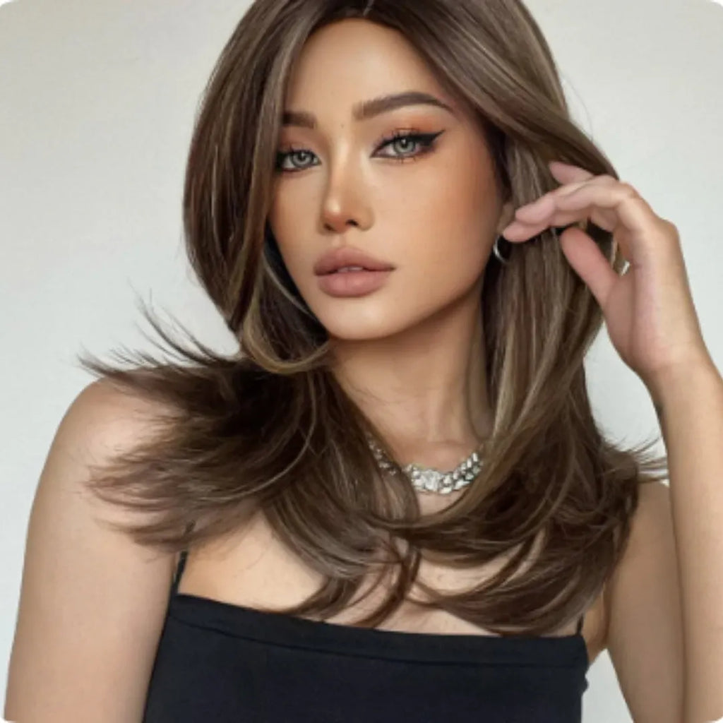 Mid-length synthetic wig with long curly hair, fringe, and platinum gradient colours