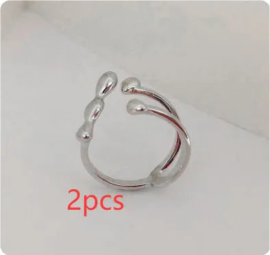 Adjustable open ring for women in brass with circular sphere design, gold or silver finish