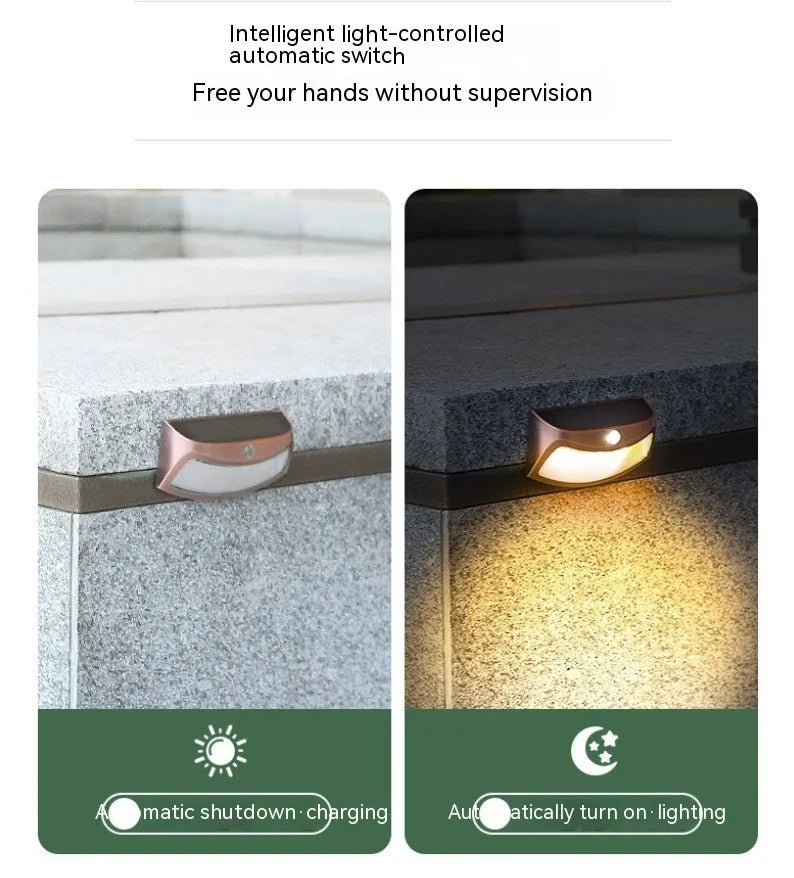 Solar outdoor wall light with smiling face design and IP65 waterproof rating