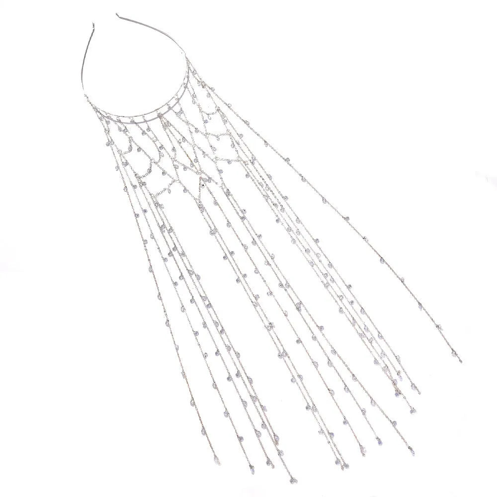 Gold rhinestone headband with mesh tassel detail on a white background.