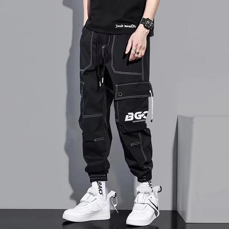 Men's loose fit polyester solid colour trousers in black or gray, autumn casual style, size S to 5XL