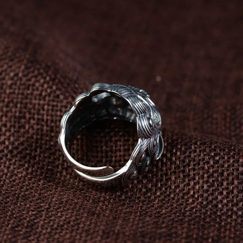 Silver open ring with detailed Jibeast pattern showing animal and zodiac modelling in retro style