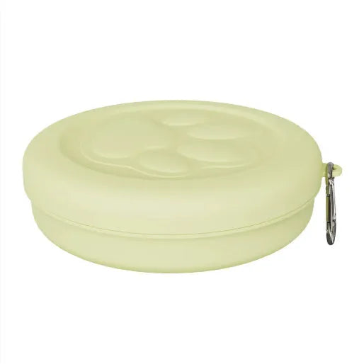 Portable outdoor dog bowl set in light green and pink, showing food bowl, water dish, and snack box compartment.