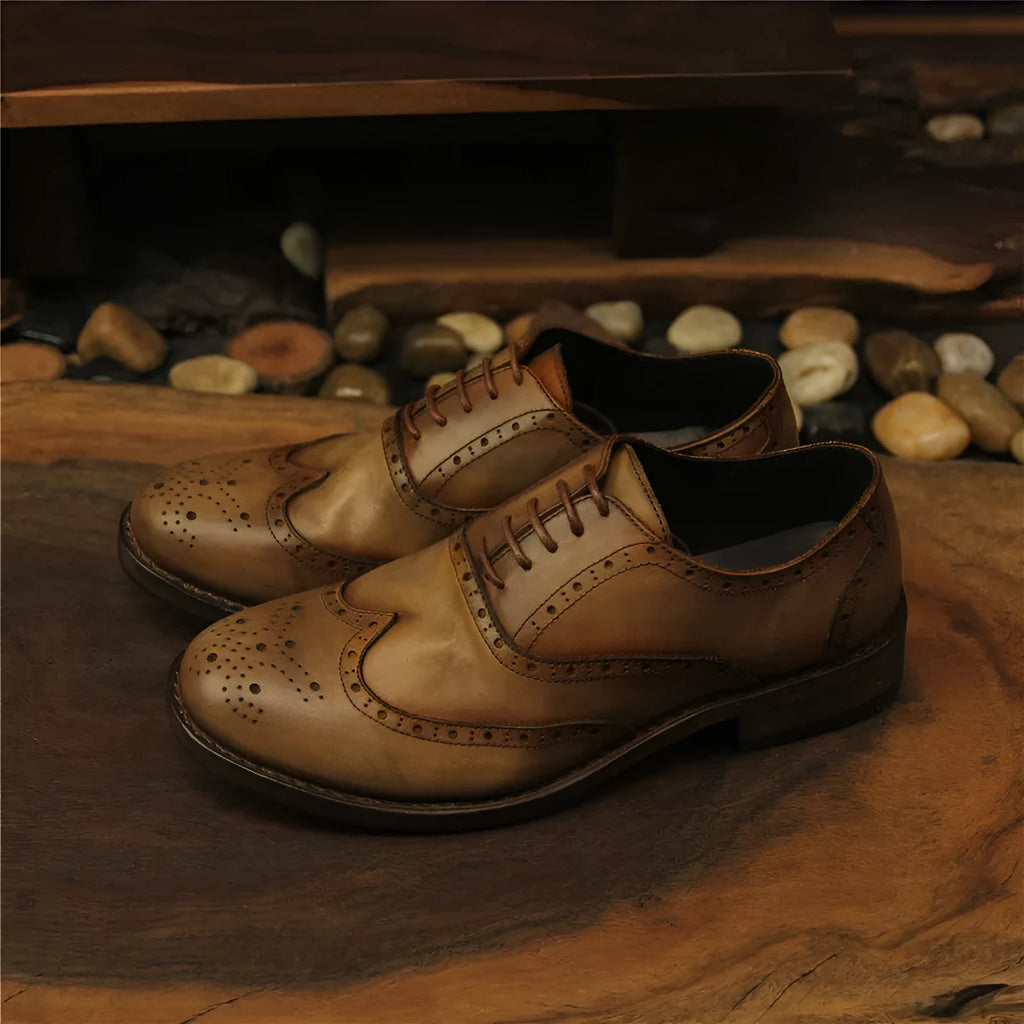 Men's light brown vintage leather casual shoes with carved distressed detailing and lace-up closure