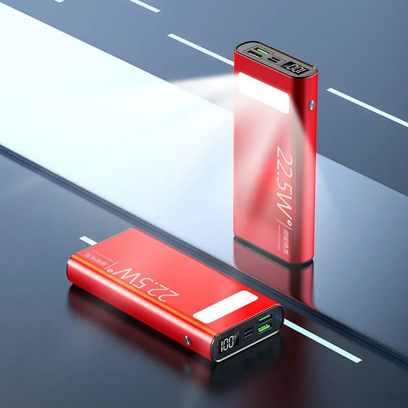 Black alloy power bank with LCD screen showing battery level, alongside green, red, and blue colour options.