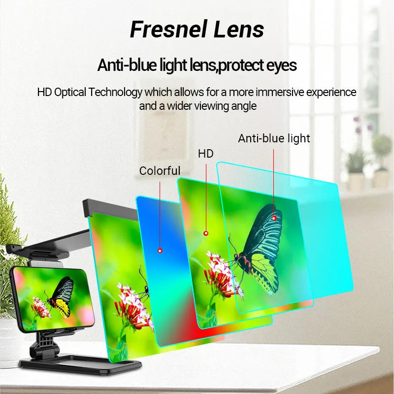 Black folding mobile phone screen magnifier with detachable holder on a desktop.