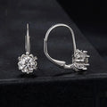 White gold plated sterling silver flower ear clip with moissanite centrepiece.