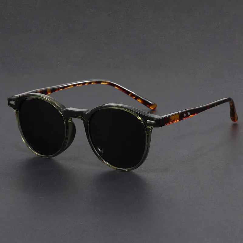 Round retro oval sunglasses with polarised lenses in Sand Black, Bright Black, Green, Gray, and Dry Tea frame colours.