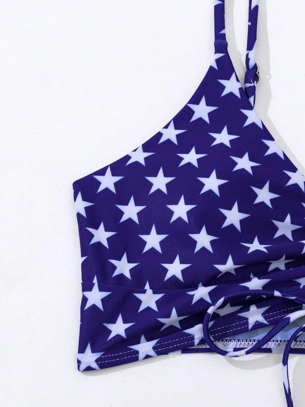 Women's high waist swimsuit with stars and stripes pattern and a drawstring waist.