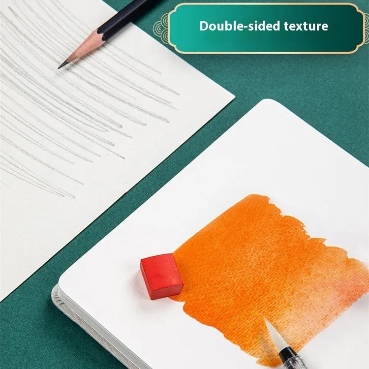 Feiluniao handmade fabric watercolour notebook in 185mm portable size, showing artistic cover design.