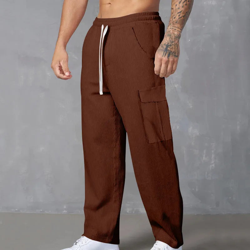 Men's corduroy cargo trousers in loose fit wide-leg design with elastic waist
